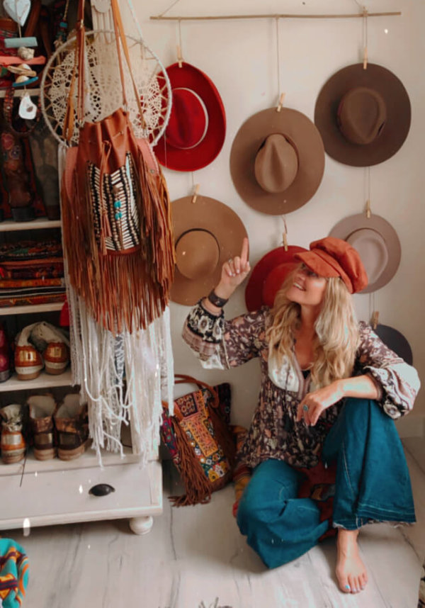 DIY hat organizer - simply use a wooden stick and some string.